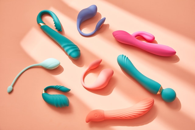 Colorful vibrators on an orange background